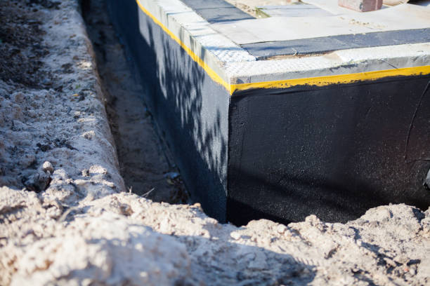 Professional Basement Waterproofing technician working in New Prague, MN